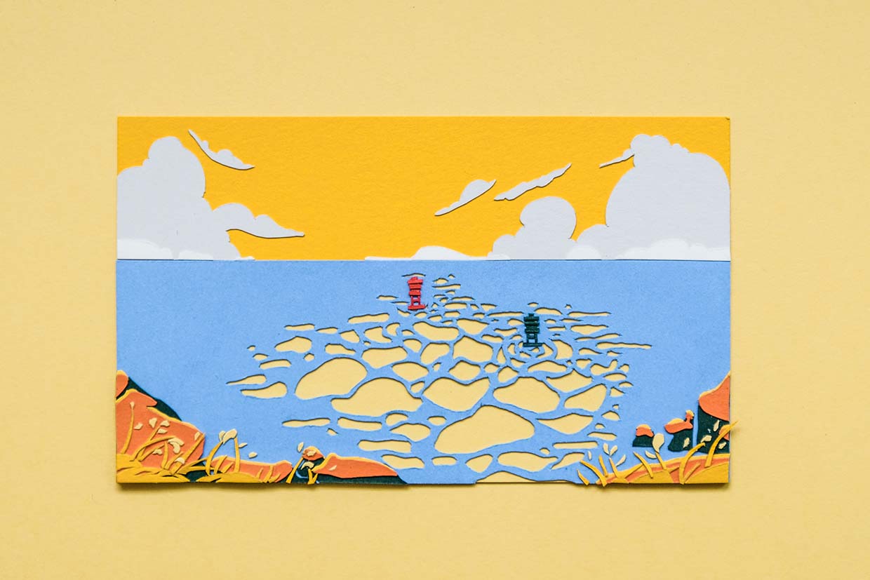 Two small paper buoys of red and green float on a calm blue sea, where gentle waves reflect a bright yellow sky. The Pacific coastline, highlighted in orange and yellow, weaves in and out of the bottom of the frame.
